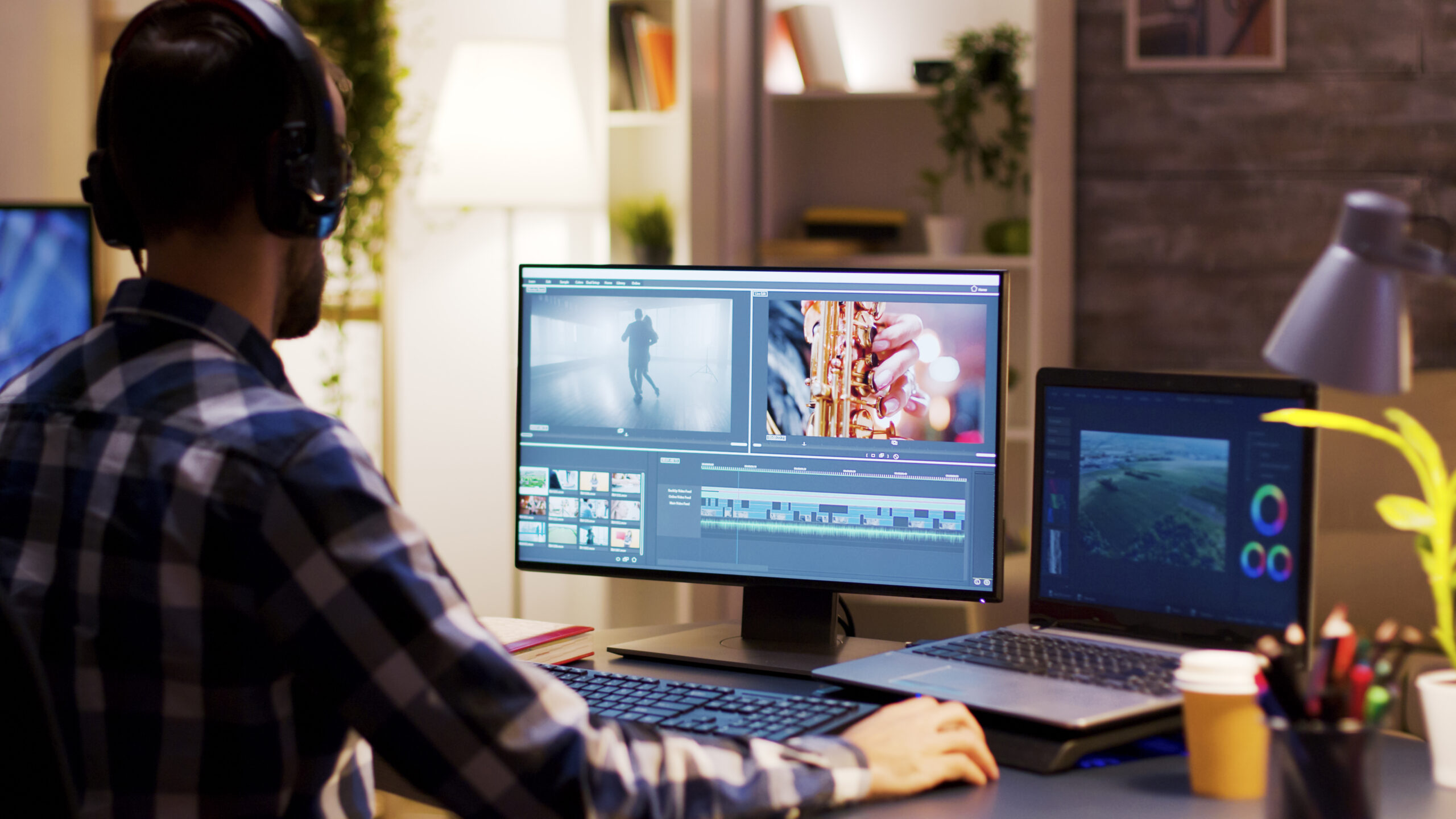 man editing videos on a computer